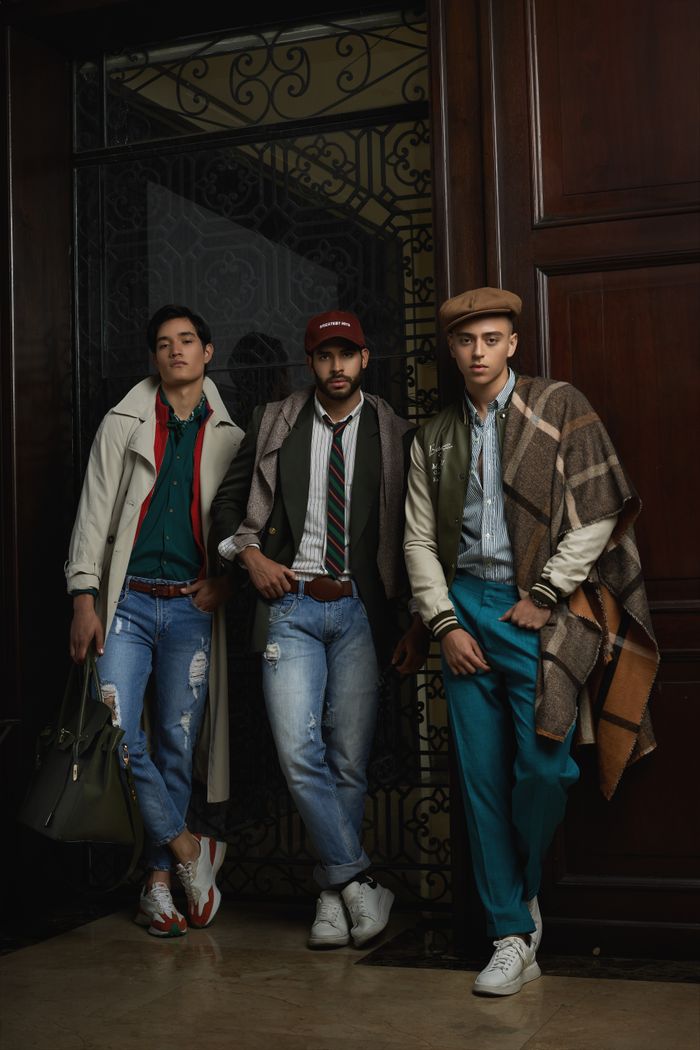 why-choose-us Three stylish men pose indoors in trendy casual attire, highlighting modern fashion trends.