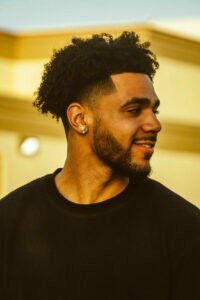 curly burst fade mullet